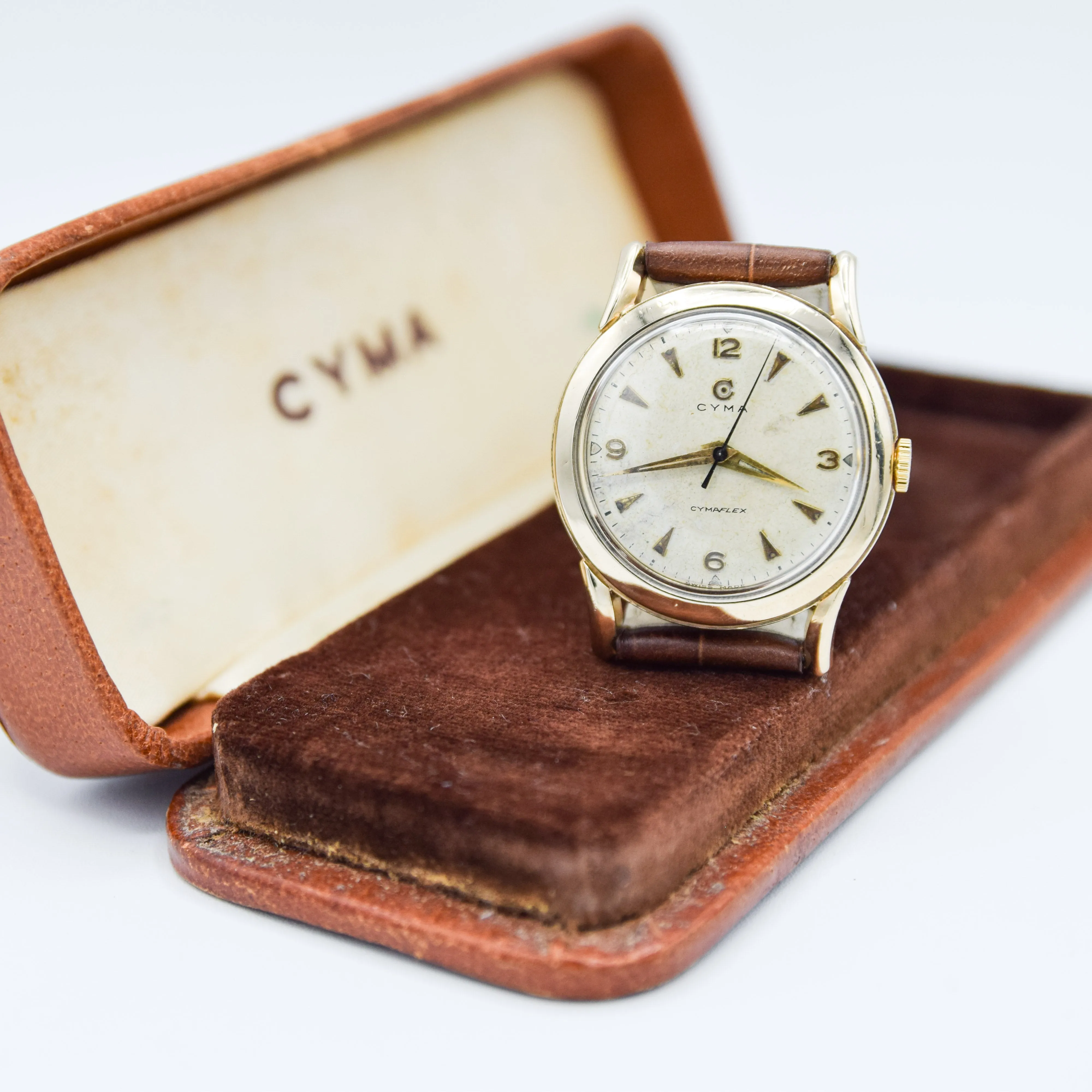 1954 Cyma Cymaflex Wristwatch Bombe Style Lugs and Mixed Arabic and Arrow Batons in Solid 9ct Gold with Original Box